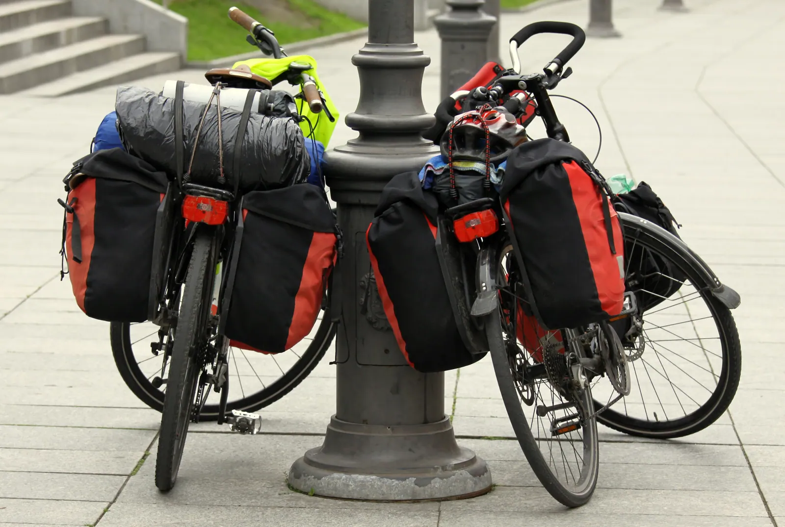 Bicycle bags arranged on a workshop bench: saddle bag, pannier, handlebar bag, bikepacking frame bag