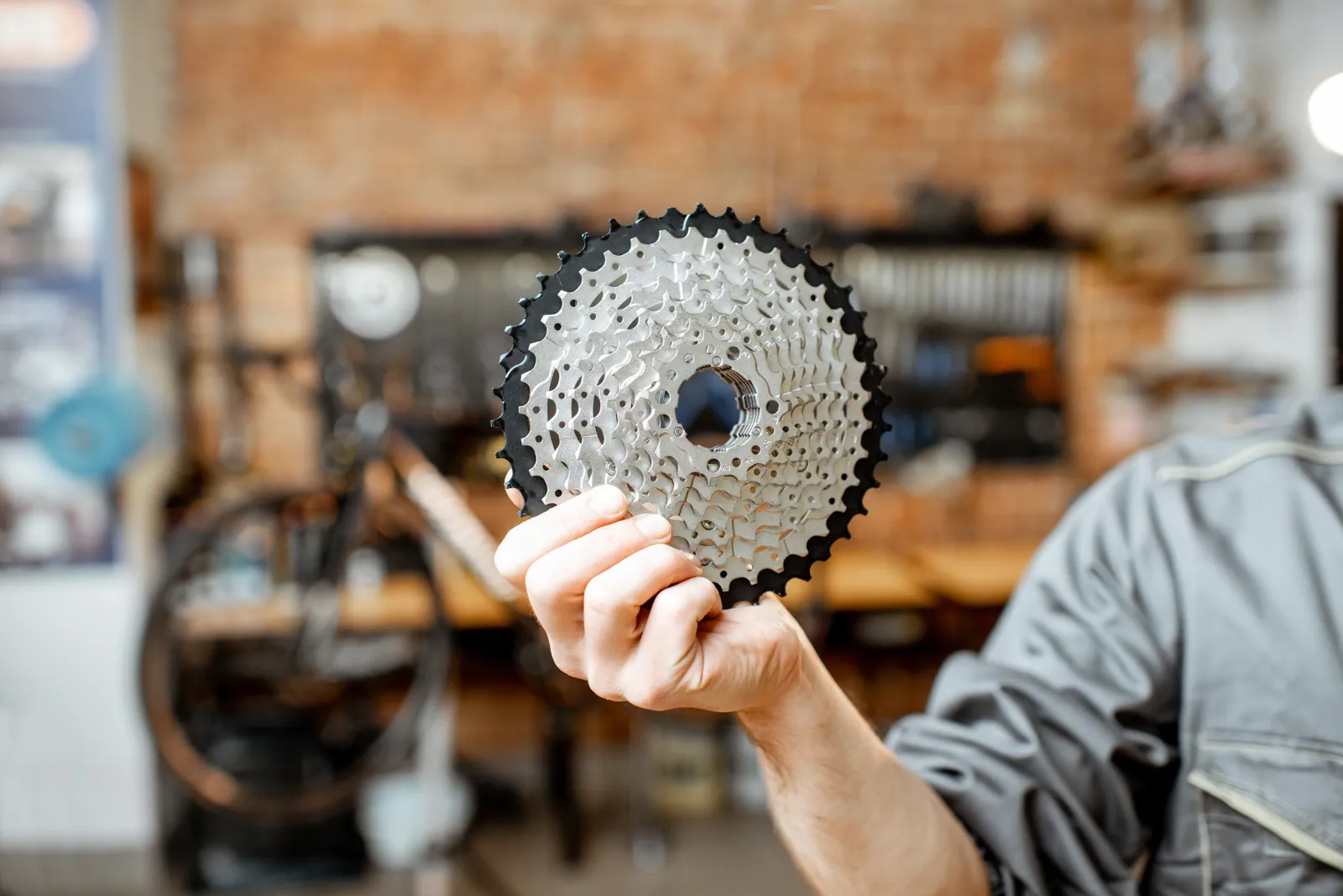 Bicycle chain and cassette paired together on a workshop bench, the consumable pair this page is built around